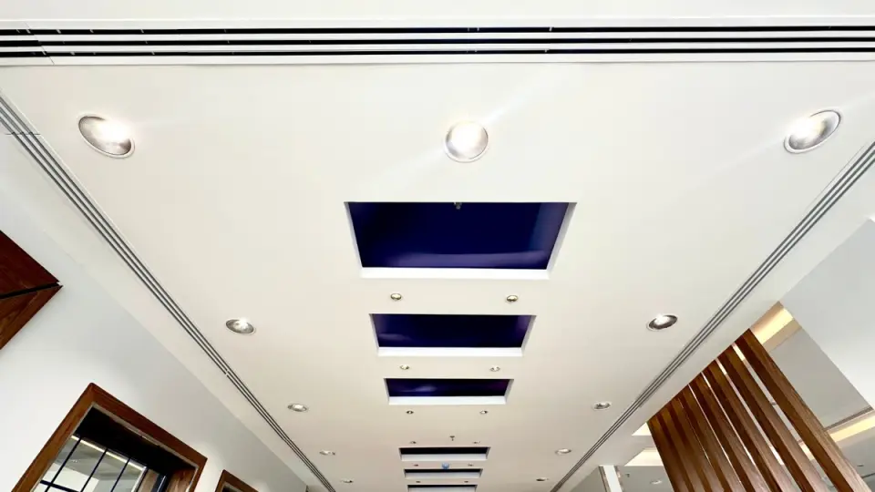 Linear slot diffusers integrated into an office ceiling