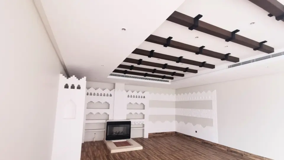 Concealed air distribution in a timber-beamed ceiling