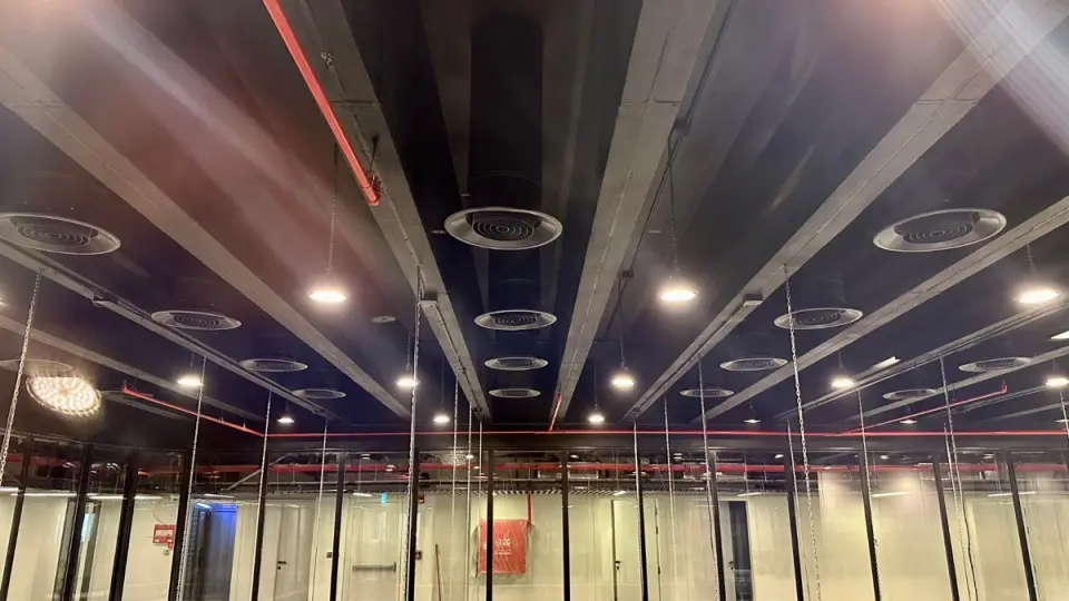 Circular diffusers in an exposed commercial ceiling